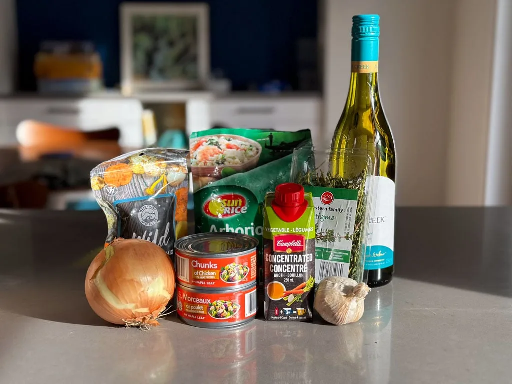 Ingredients for making dehydrated mushroom risotto are grouped together on a kitchen counter.